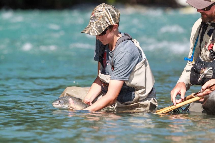 Kid Releasing a nice bull trout
